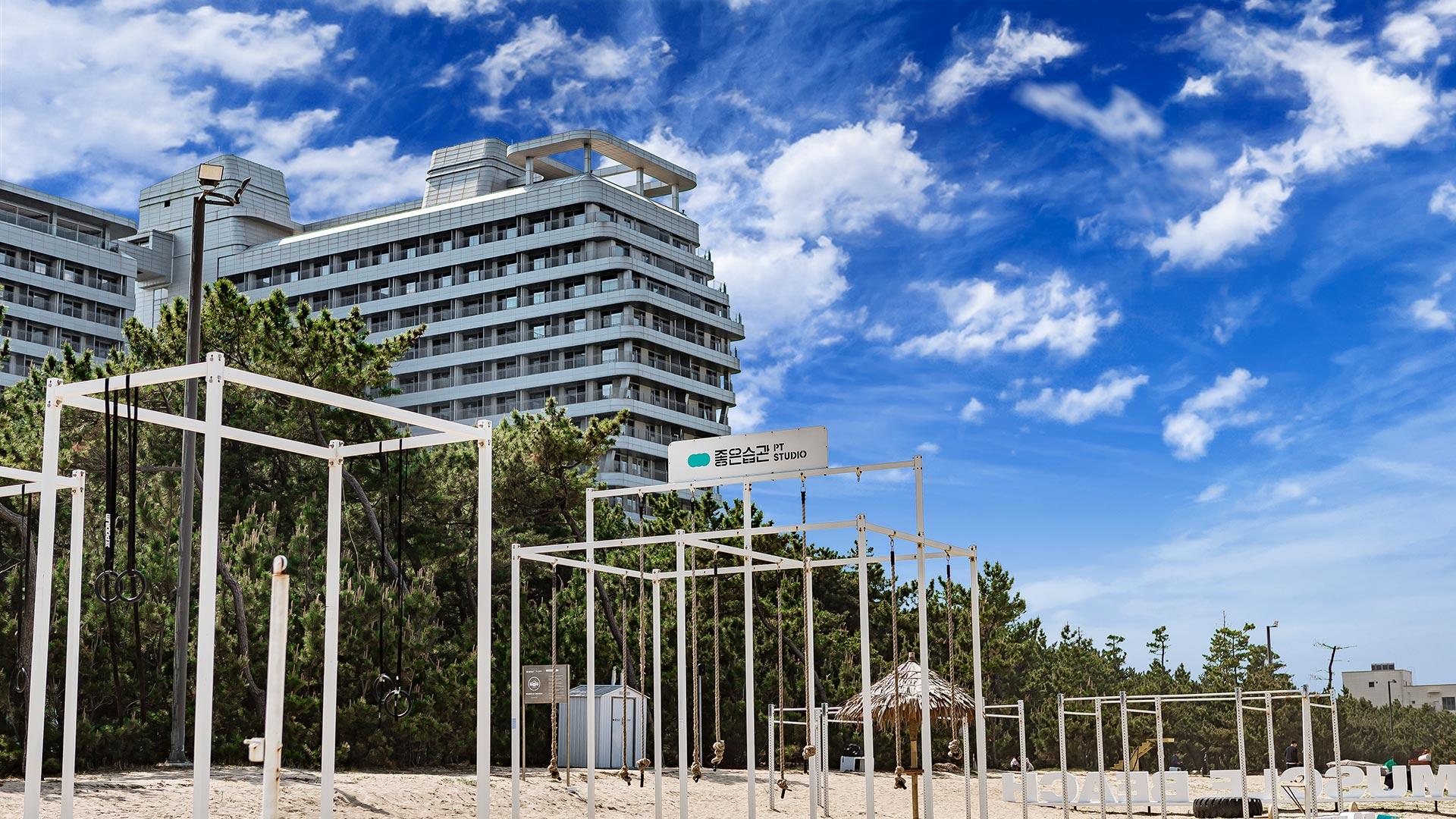 Muscle Beach with views of pine trees and St. John's Hotel