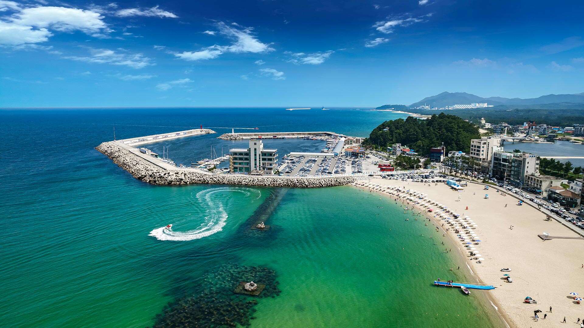 People enjoying swimming at Anmok Beach 01